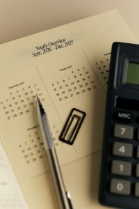 Kaboompics - 2027 Yearly Overview With Calculator Pen and Paper Clip