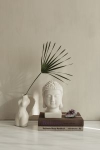 Kaboompics - White Buddha Bust And Crystals In Soft Window Light