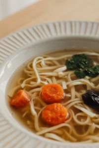 Kaboompics - Close-Up Chicken Broth with Carrot and Noodles