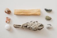 Kaboompics - White Sage Bundle, Palo Santo and Stones on a Minimal Beige Background