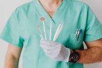 Kaboompics - Dental Mirror and Probe in Gloved Hands