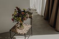 Kaboompics - Glass Vase Bouquet on Woven Seat in a Sunlit Room
