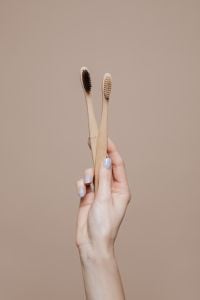 Eco-Friendly Oral Care Campaign with a Female Dentist and Bamboo Toothbrushes