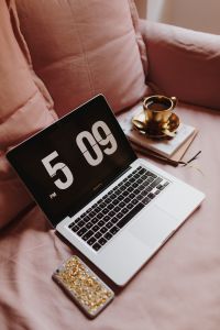 Kaboompics - Close-Up of Laptop and Coffee on a Blush Pink Sofa