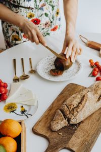 Kaboompics - Woman Cutting Fresh Produce for a Homemade Meal