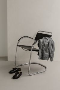Kaboompics - Leather Jacket and Black Flats on Chrome Chair