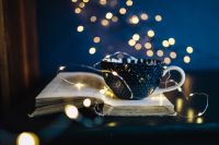 Kaboompics - Cup of coffee, book, fairy lights