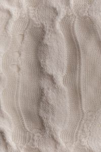 Kaboompics - Vertical Cream Knit Texture With Organic Pattern