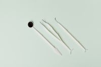 Kaboompics - Diagonal Dental Exam Tools Flat Lay with Copy Space