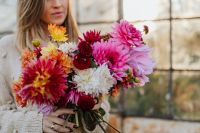 Kaboompics - Woman Holding Colorful Dahlia Bouquet In Greenhouse