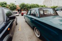 Kaboompics - Vintage Blue Sedan Parked among Cars at LX Factory in Lisbon, Portugal, Urban Travel Photo