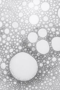 Kaboompics - Dense White Cosmetic Foam Bubbles with Large Round Cells, Vertical Skincare Texture Background for Beauty and Product Design
