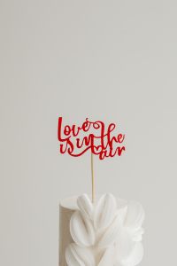 Kaboompics - Love Is in the Air Valentine Cake Topper Against a White Background