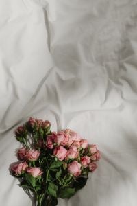 Kaboompics - Small Pink Flower Bouquet on White Bedding