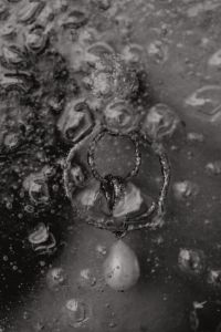 Kaboompics - Gold Chain Jewelry on Woman's Hand with Water Droplets