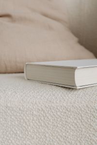 Kaboompics - Minimal Book Cover Mockup on Textured Cream Upholstery with Soft Neutral Background