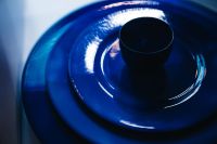 Kaboompics - Glossy Blue Ceramic Plate and Dark Cup Close Up