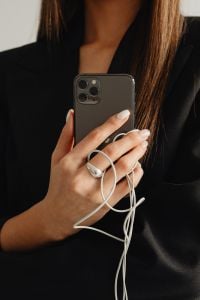 Kaboompics - Close-Up of a Smartphone and White Wired Earphones