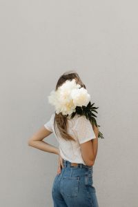 Kaboompics - Woman Holding White Flower Bouquet in Front of Her Face