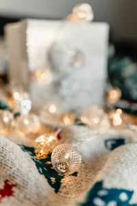 Kaboompics - Soft-Focus White Gift Box with Silver Ornaments and Lights