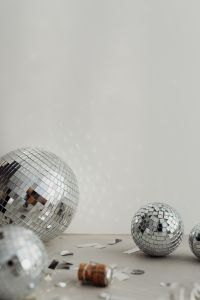 Kaboompics - Large Disco Ball Foreground with Reflected Lights and Smaller Mirror Balls