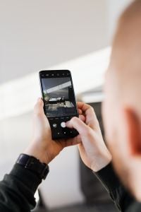 Kaboompics - Man Takes Photo by Mobile Phone