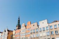 Kaboompics - Historic Gdańsk Townhouses and Clock Tower in a Sunny Streetscape