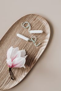 Kaboompics - Tampons and Pink Magnolia on a Wooden Tray, Feminine Hygiene Still Life