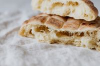 Fresh Slovenian Loaf Torn Open to Show Airy Crumb, Artisan Bread Recipe Photography