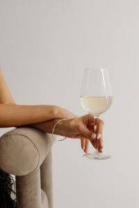 Kaboompics - Stylish Evening Celebration Portrait with Woman and Stemmed Wine Glass