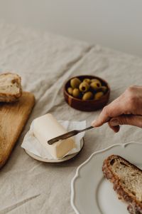 Kaboompics - Spreading Butter on Sourdough Bread