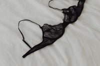 Kaboompics - Black Lace Bra Close-Up on White Bedding