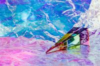 Kaboompics - Angled Glass Prism on Pink and Blue Foil for Abstract Product Backgrounds