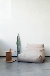 Kaboompics - Beige Armchair and Wooden Table in a Minimal Interior