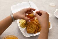 Kaboompics - Dipping Fried Chicken In Sweet Chili Sauce