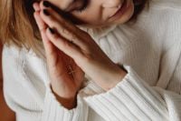 Kaboompics - Clasped Hands in Prayer Wearing a Gold Cross Necklace
