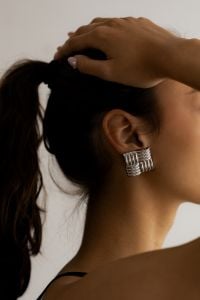 Kaboompics - Side Profile of Woman Wearing Textured Silver Statement Earring