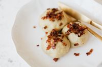 Kaboompics - Traditional Polish Pyzy with Meat, Overhead on a White Plate