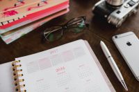 Kaboompics - Vintage Cameras, Eyeglasses and Pink Floral Planner with Smartphone, Desk Flat Lay