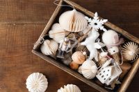 Kaboompics - Christmas Ornament Box with Paper Decorations and Nutcracker