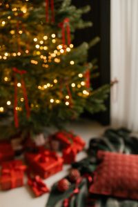Kaboompics - Christmas Tree Bokeh with Red Presents and Dark Green Festive Decor