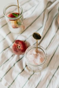 Kaboompics - Two Glass Jars of Fruit Yogurt and Fresh Fruit