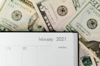 Kaboompics - Cash Bills on an Open 2021 Calendar Page