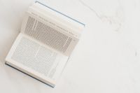 Kaboompics - Open book on marble table