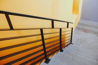 Kaboompics - Staircase by a yellow wall