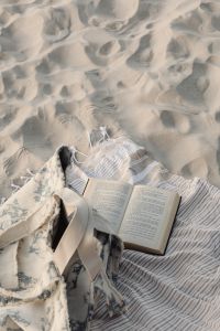 Kaboompics - Open Book and Beach Tote on a Striped Towel Flat Lay