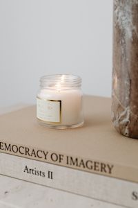 Kaboompics - Close-Up of White Candle and Textured Vase
