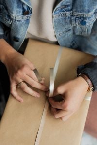 Kaboompics - Wrapping a Gift in a Coffee Shop with Dessert and Coffee