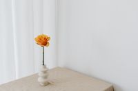 Kaboompics - Orange Rose and Goldenrod in White Vase, Soft Autumn Floral Still Life
