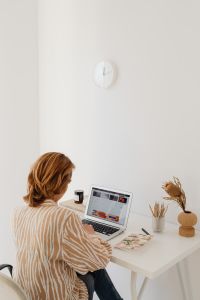 Kaboompics - Home Office Woman Using Laptop with Minimal Wall Copy Space